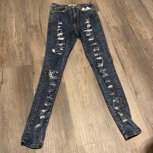 long dark washed distressed skinny jeans
